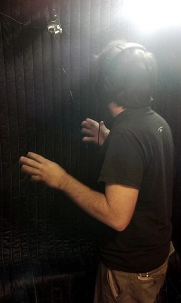Actor in a voiceover booth.